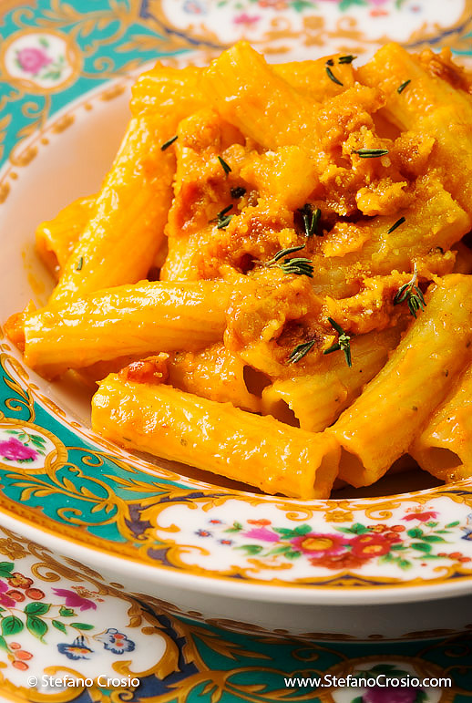 Tortiglioni Pancetta closeup of Pasta Pepper Italian food on beautiful floral pattern china