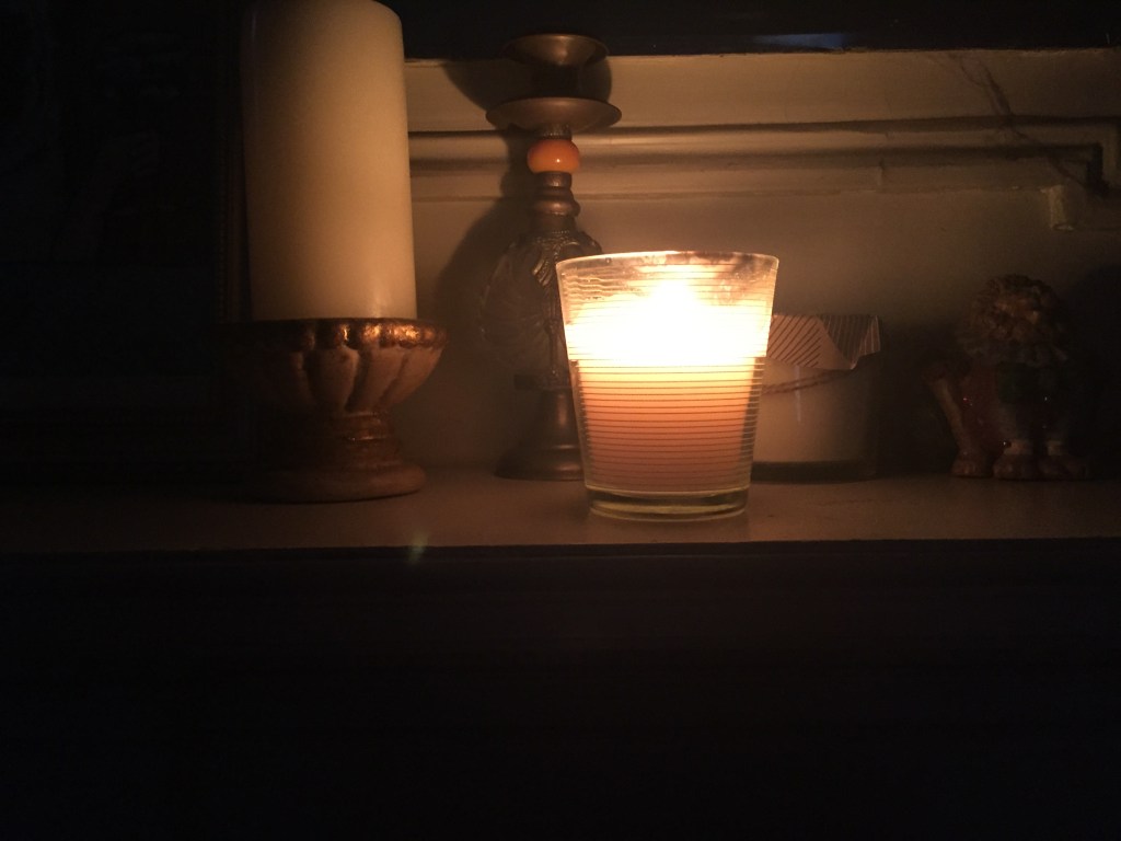 A candle burns in Brooklyn